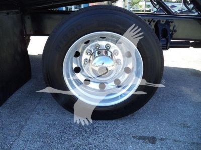 Peterbilt 337 wheel and hub showing polished chrome rim and tire.