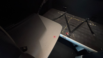 Kenworth truck part view showing interior sleeper area with seat belt buckle and cabin paneling.