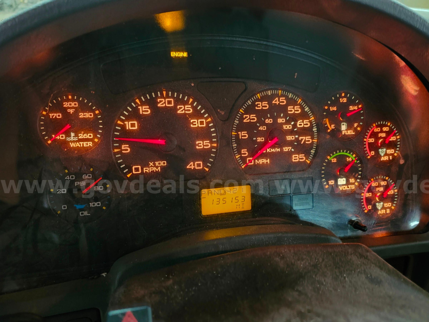 Dashboard of a 2004 International 4200 truck showing gauges and odometer with yellow digital display.