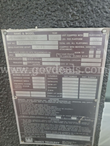 Plate with technical specifications for a vehicle: Name & Model H L? TOWN? IL 3? Year 2004, unit equipped with lbs per platform, platform details, cylinder counts, hydraulic system, and warnings. Numerous small labels and fields indicating 