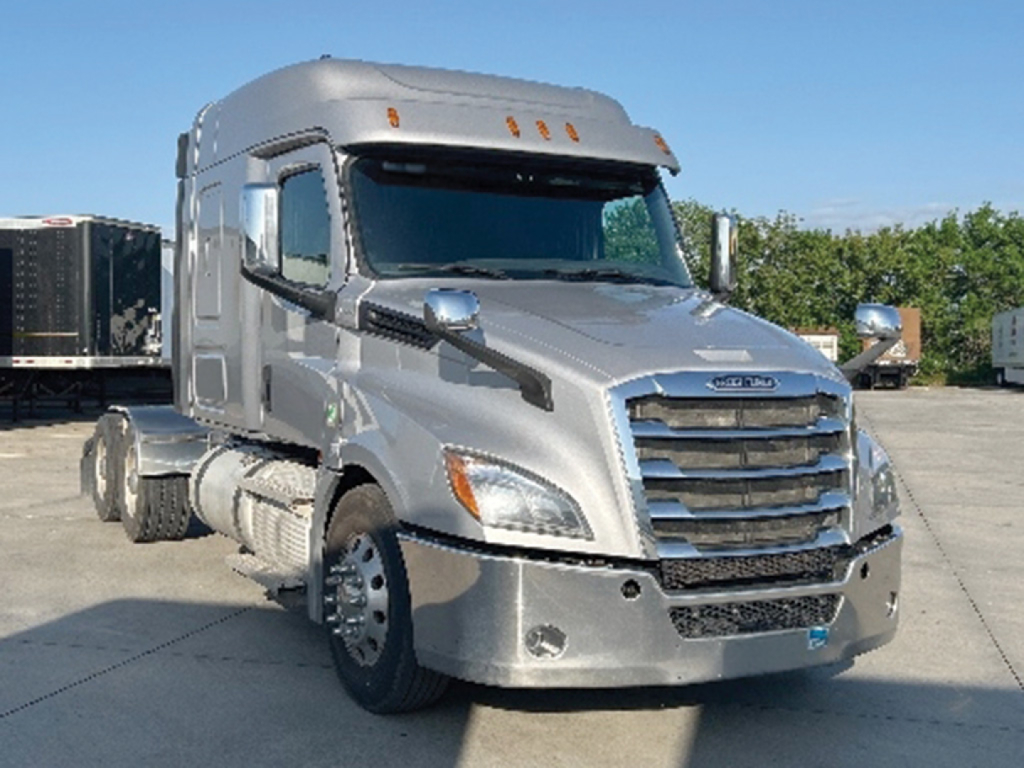 Truck cab exterior of a silver 2020 Freightliner Cascadia126 conventional sleeper, front view with chrome grille and headlights.