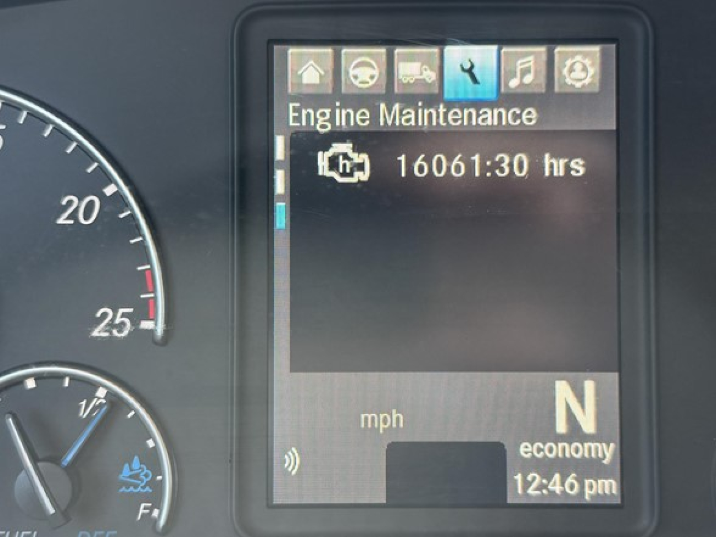 Dashboard screen showing Engine Maintenance with 16061:30 hrs and gear indicator N in economy mode; speedometer and tachometer partially visible.