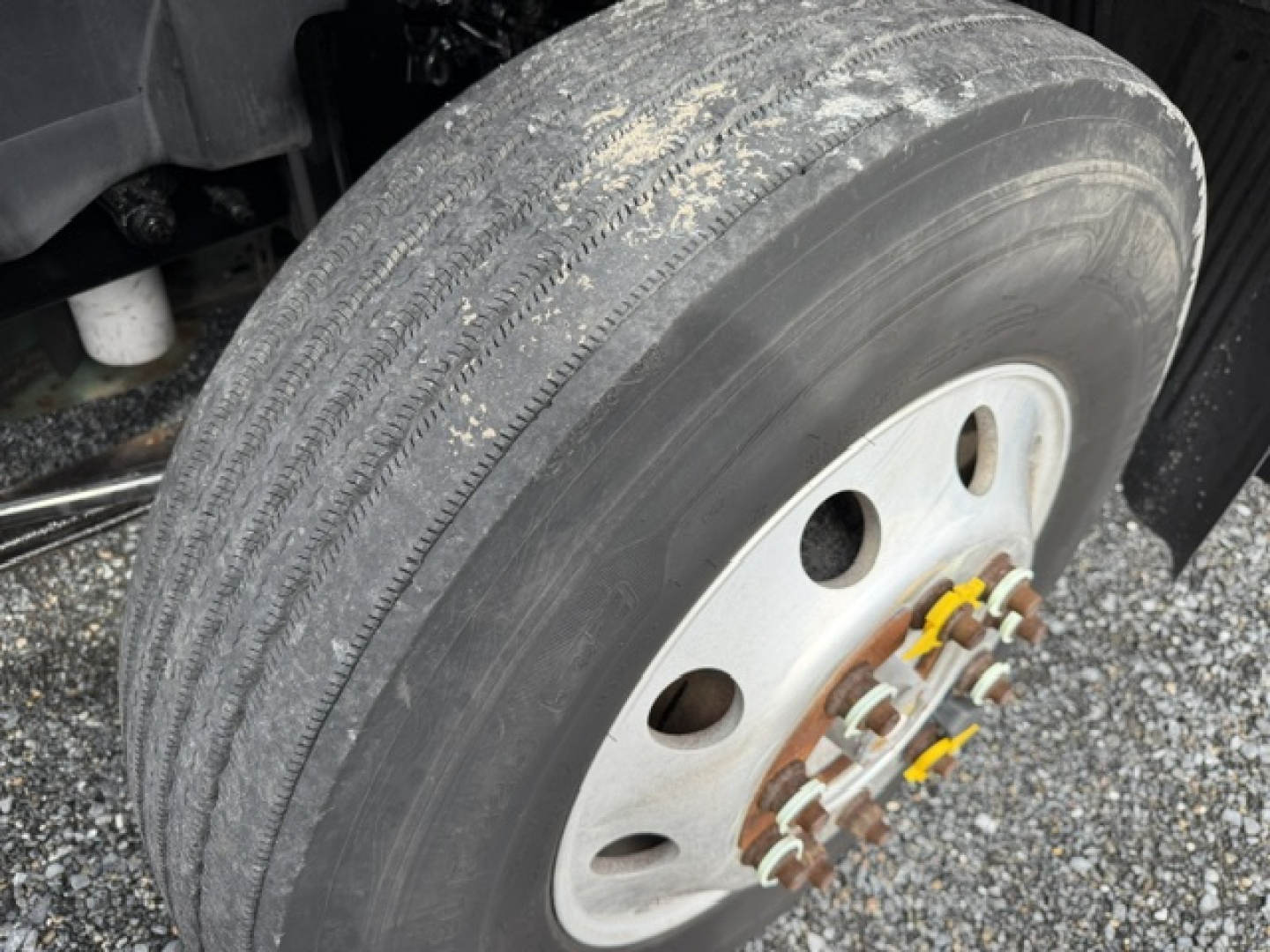 Volvo VNL truck wheel and tire with hub and lug nuts in view