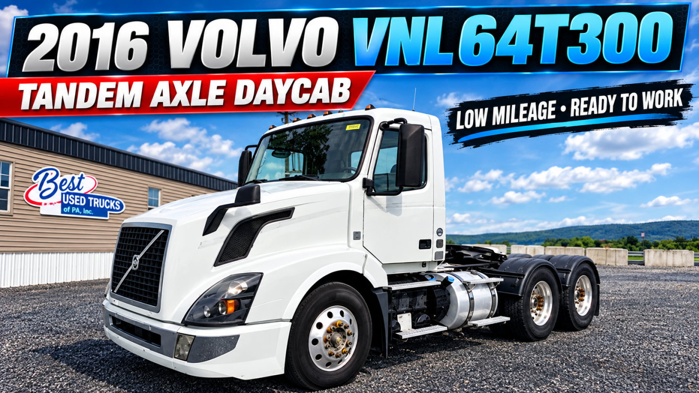 2016 Volvo VNL64T300 tandem axle daycab showing truck with white cab and dark chassis, fuel tanks, and chrome bumper.