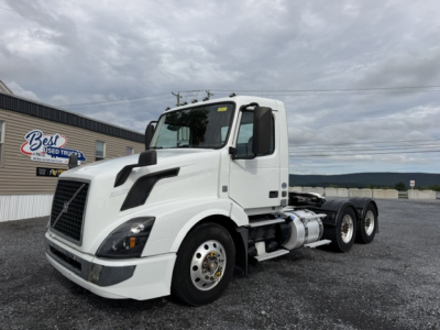 2016 Volvo VNL64T300 truck chassis side view showing cab and rear air cleaner with fuel tanks and wheels.