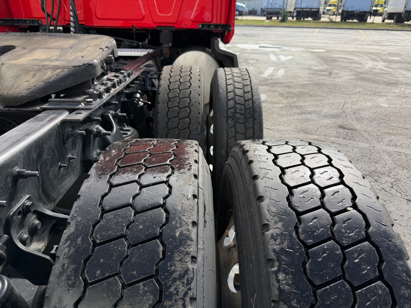 Truck axle and dual rear tires of a 2020 International LT625 Conventional Sleeper showing dual rear wheels and tread pattern.