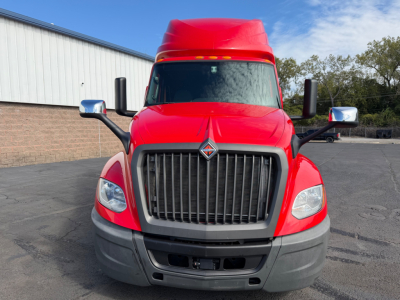 Front view of a red 2020 International LT625 conventional sleeper truck showing grille, headlights, and side mirrors.