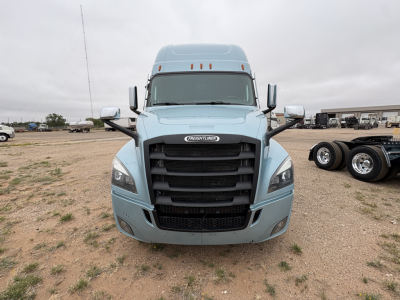 Freightliner Cascadia 126 truck front view showing grille and headlights, light blue exterior.