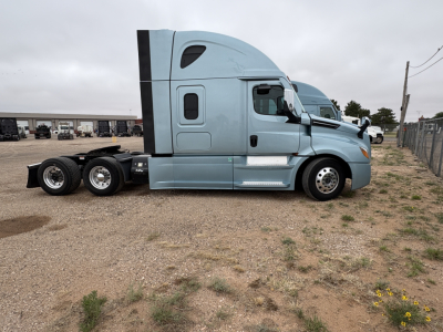 Freightliner Cascadia 126 tractor side profile showing sleeper cab and dual rear axles.