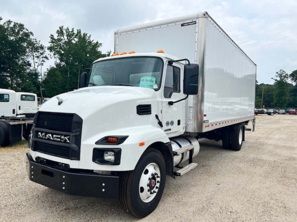 Box truck: white 2025 Mack MD6 with large cargo box, cab with black grille, side mirrors, and dual rear wheels. No visible text on the truck exterior.