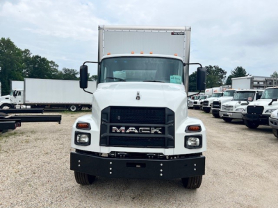 Front view of a white 2025 Mack MD6 box truck with black grille and bumper, showing MACk logo and headlights.
