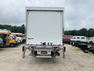 MD6 box truck rear view showing cargo area and rear underride guard with reflective tape.