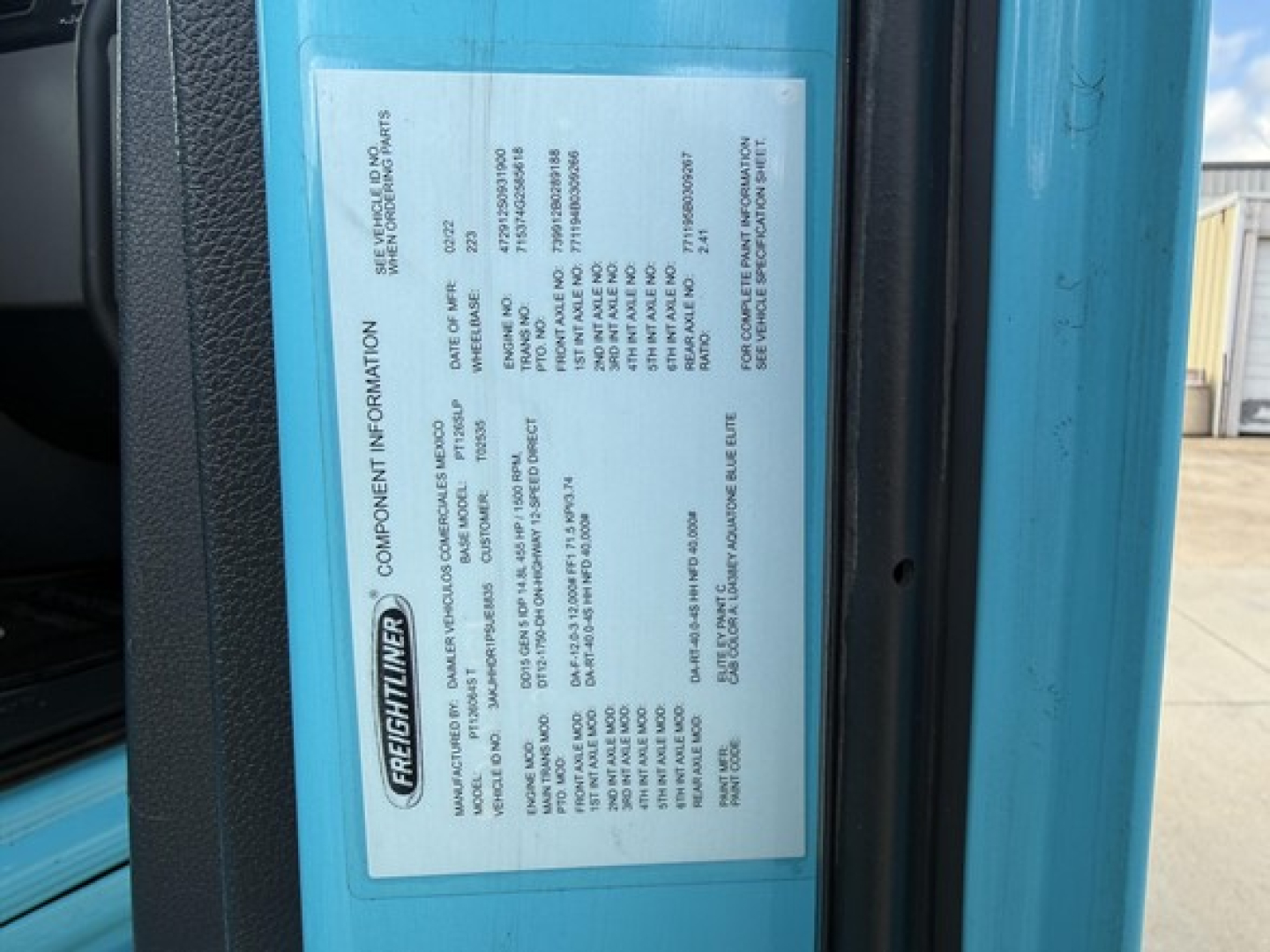 Freightliner Cascadia 126 label on door jamb with specifications and VIN information.