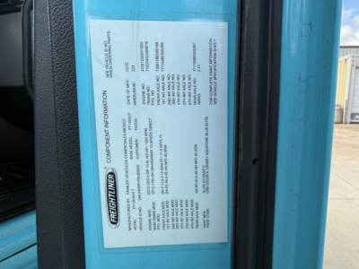 Freightliner Cascadia 126 label on door jamb with specifications and VIN information.