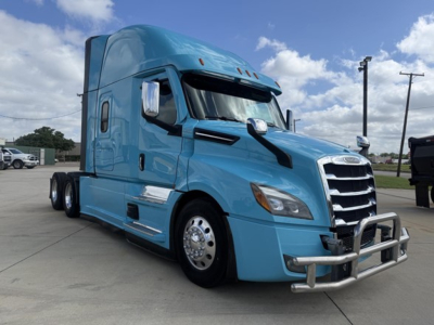 Freightliner Cascadia 126 sleeper truck in blue, front and side view with chrome bumper guard and large grille; no text visible on image.