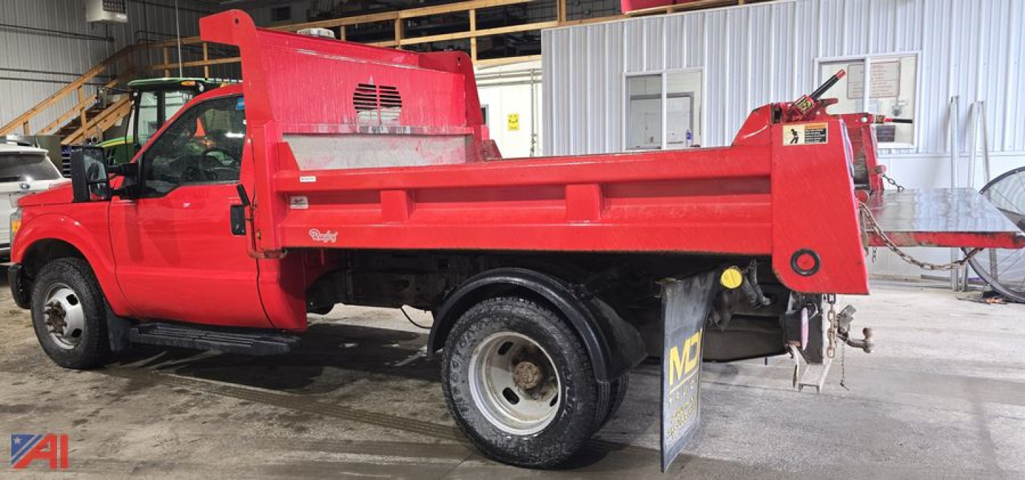 Red 2016 Ford F-350 XL Super Duty dump truck side view showing dump bed and chassis in workshop.