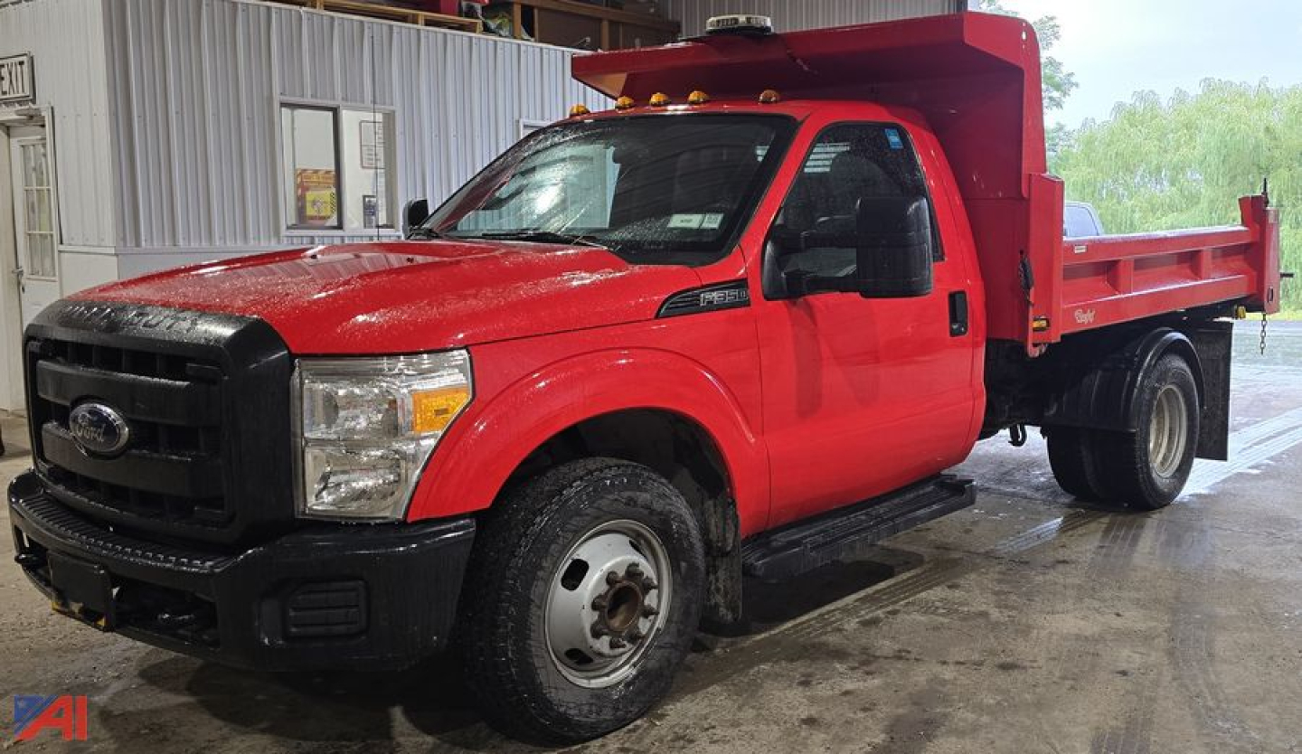 Ford F-350 XL Super Duty dump truck in red with dump bed and black grille, front view angled.