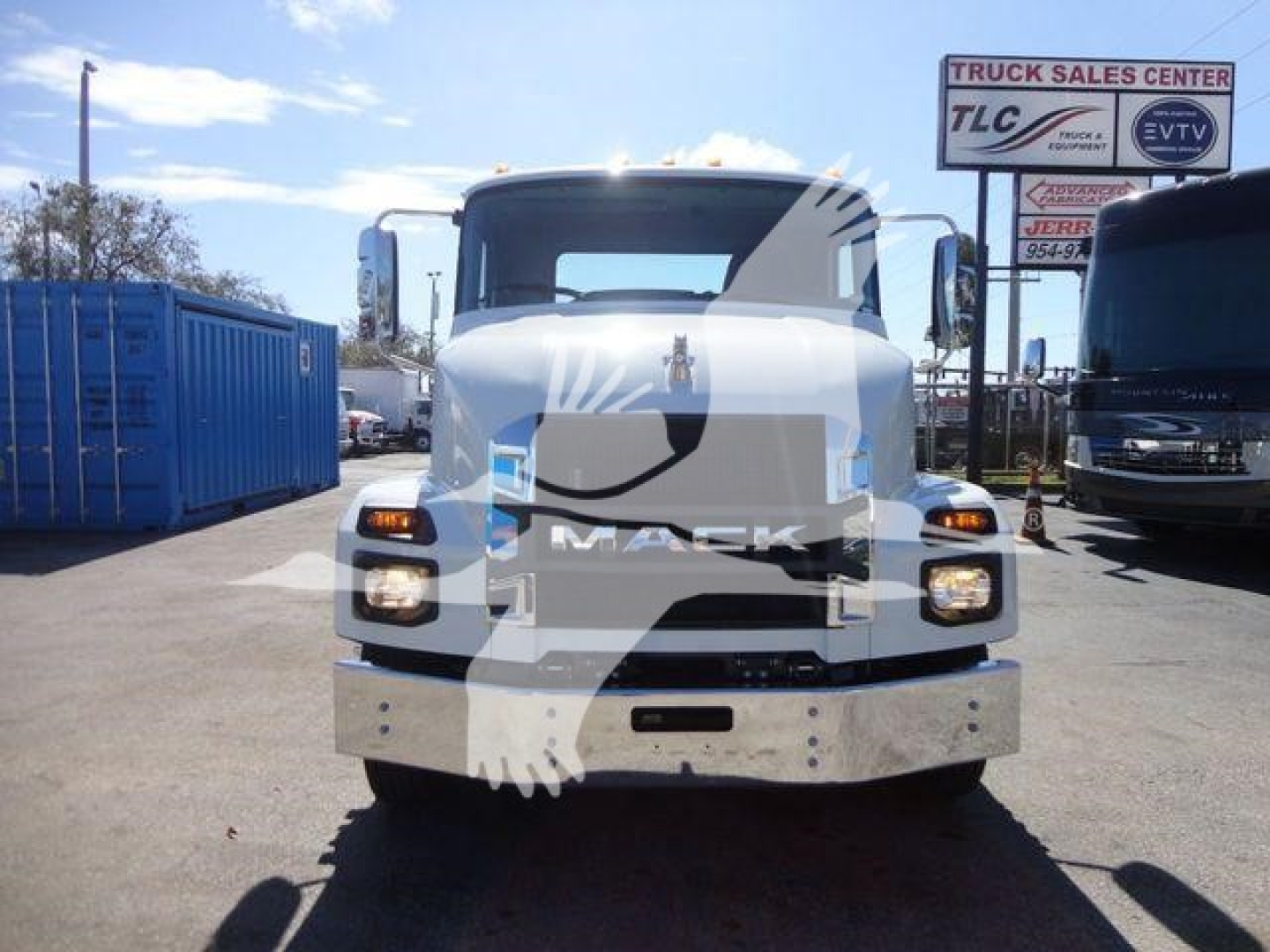 Front view of a 2027 Mack MD6 truck showing large chrome bumper and grille, with headlights and badge visible.