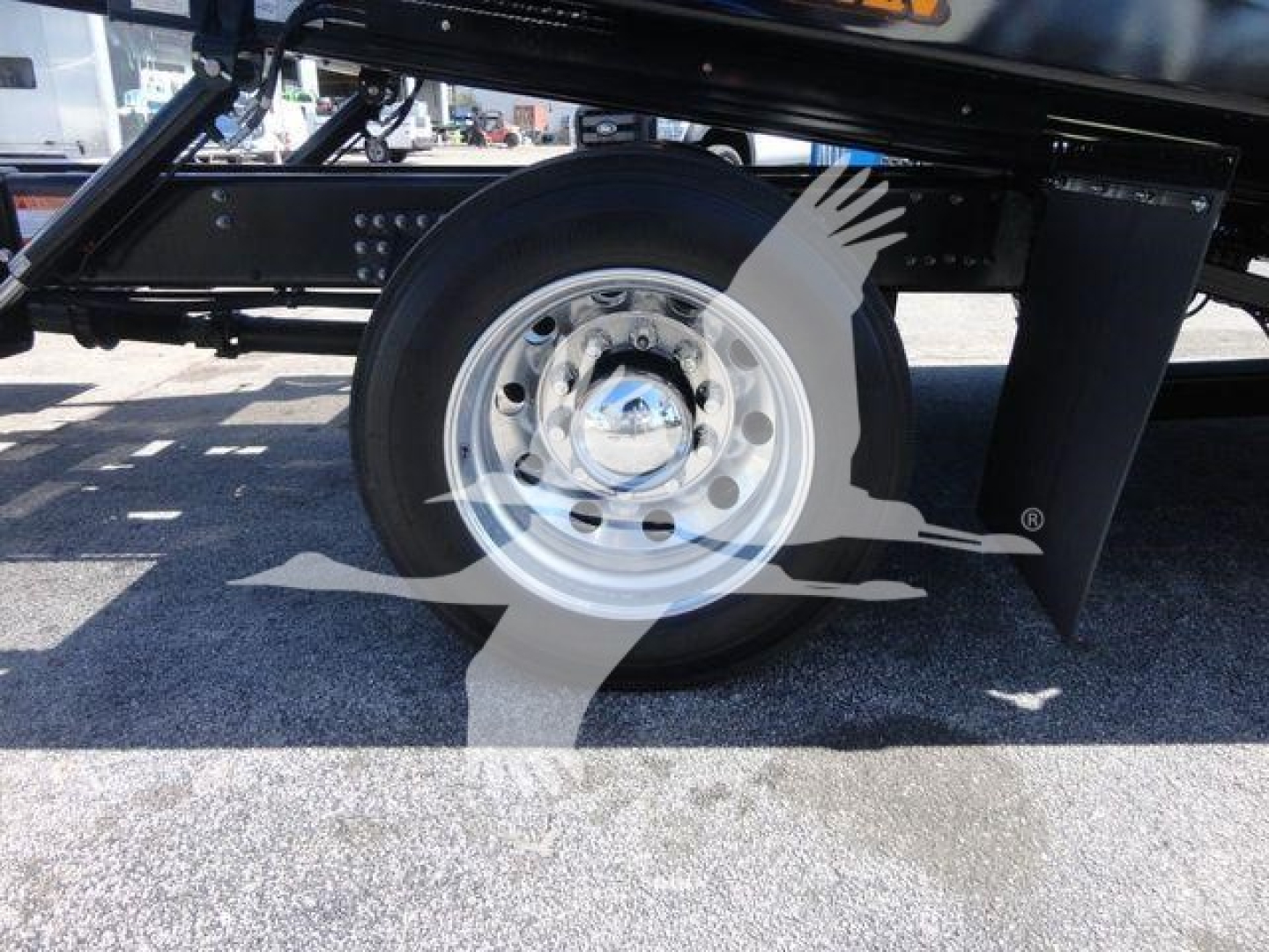 MD6 truck wheel and undercarriage view showing steel wheel and black chassis components.
