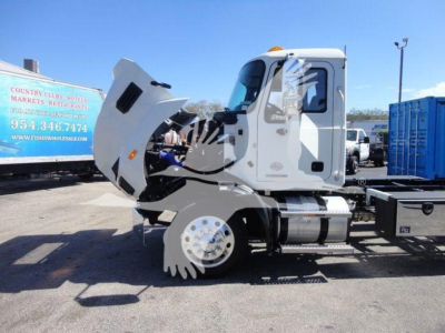 MD6 truck cab with raised hood showing engine area and front wheel well, side view profile, white cab and chassis.