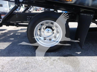 MD6 truck wheel and undercarriage view showing steel wheel and black chassis components.
