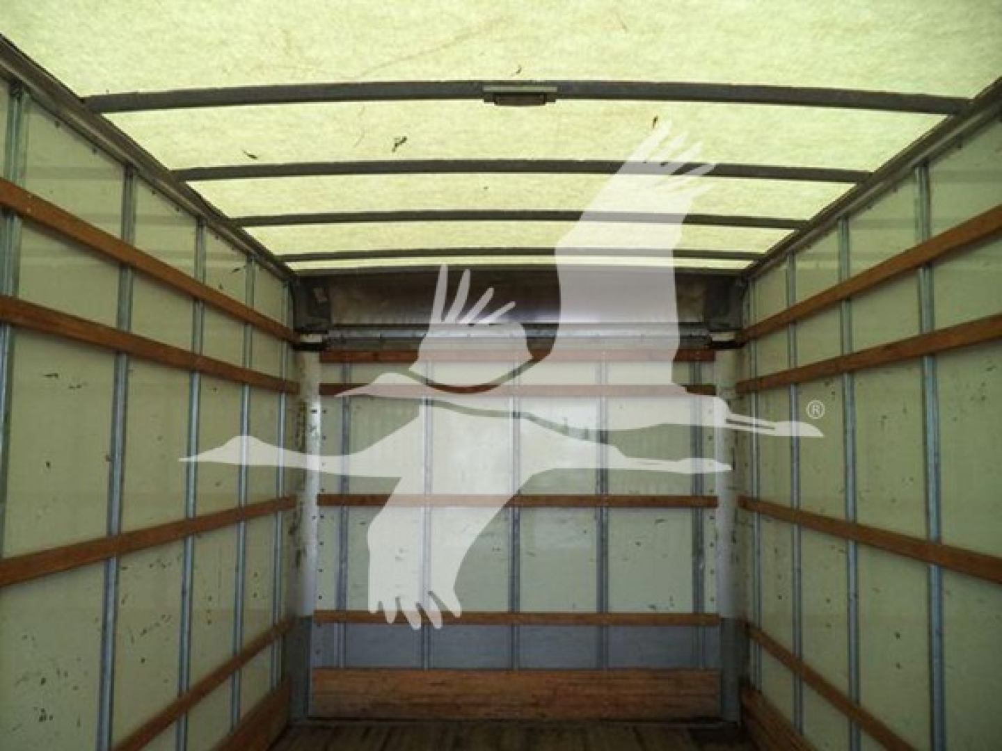 Box truck cargo area with wooden side rails and metal walls, interior view of a 2018 International Durastar 4300 cargo box.