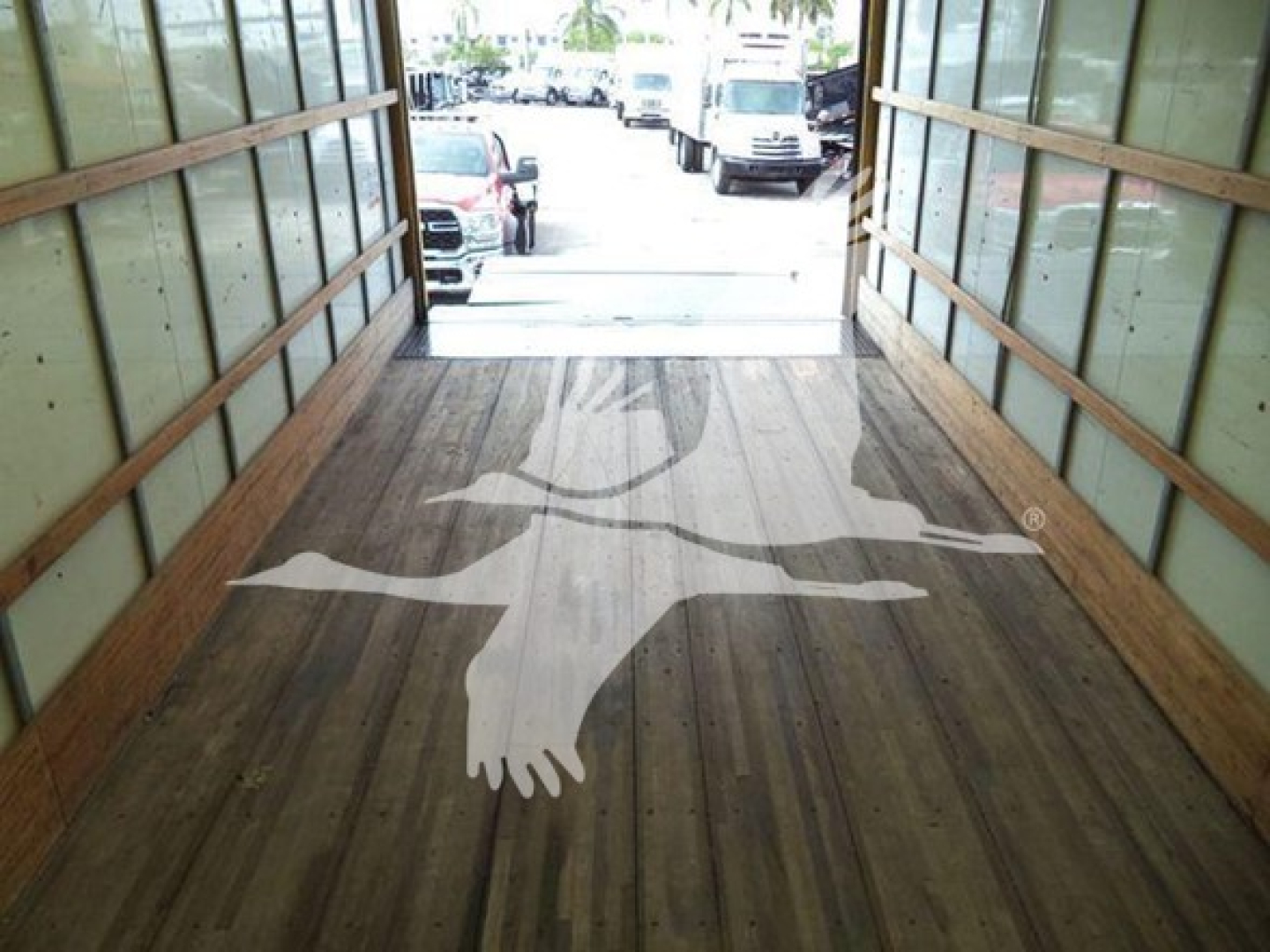 Truck interior showing wooden floor with deer logo graphic in the cargo area of a 2018 International Durastar 4300