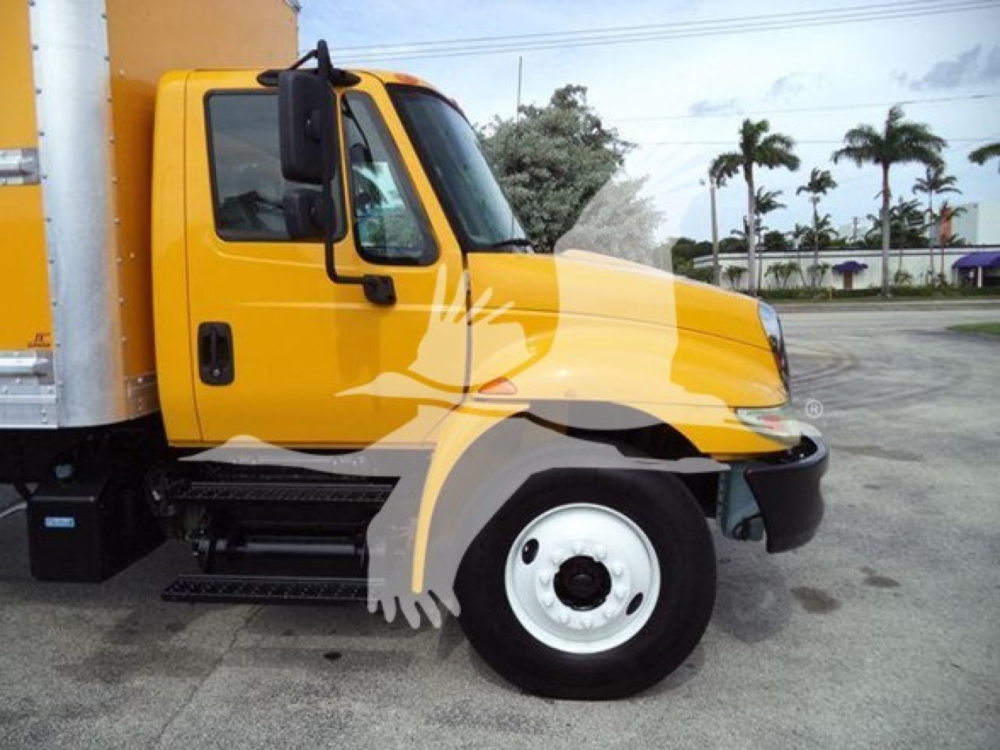 Yellow 2018 International Durastar 4300 box truck side view showing cab and front wheel with stock number T46539 and VIN 3HAMMMML4JL446539