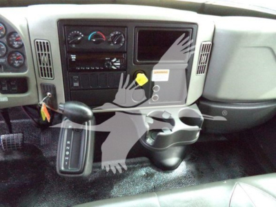 Cab interior of a 2018 International Durastar 4300 showing steering column, dashboard controls, gear selector, and center console.