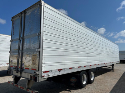 Trailer side and rear showing 2018 Utility Reefer refrigerated trailer with silver aluminum panels and dual rear doors.