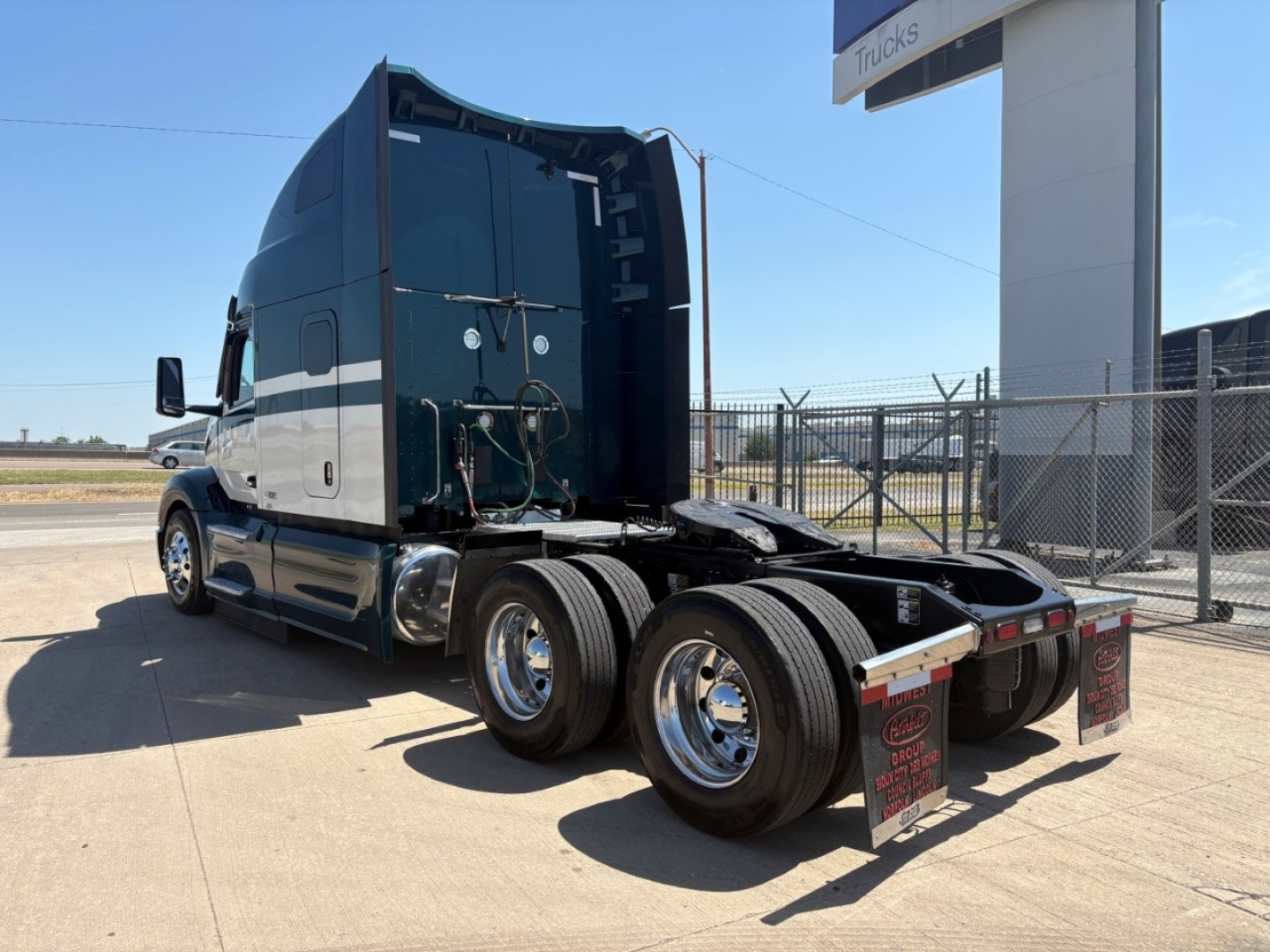 Peterbilt 579 truck cab and chassis viewed from rear-left, with dual rear axles and mud flaps, VIN and stock details not visible on image.