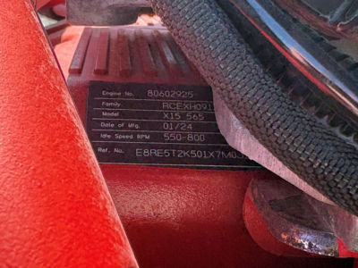 Close-up of engine data plate in Peterbilt truck showing Engine No. 80602925, Family RCEC HX... Model X15 565, Date of Mfg 01/24, Idle Speed 550-800 RPM, Ref. No. E8RE5T2K501X7M0J.