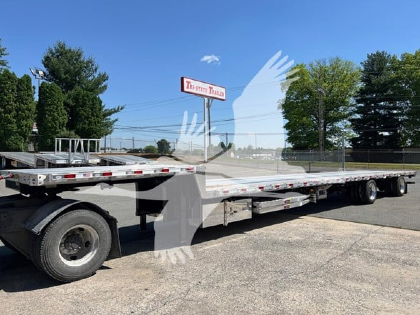 Trailer: 2027 Dorsey Combo Drop with Ramp Kit showing long flatbed trailer with dual rear axles and ramps.