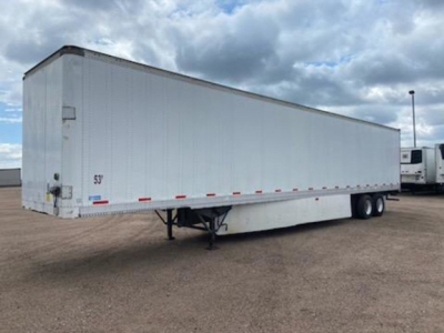 Trailer side view showing 53' Stoughton van trailer with dual rear axle and lander legs.
