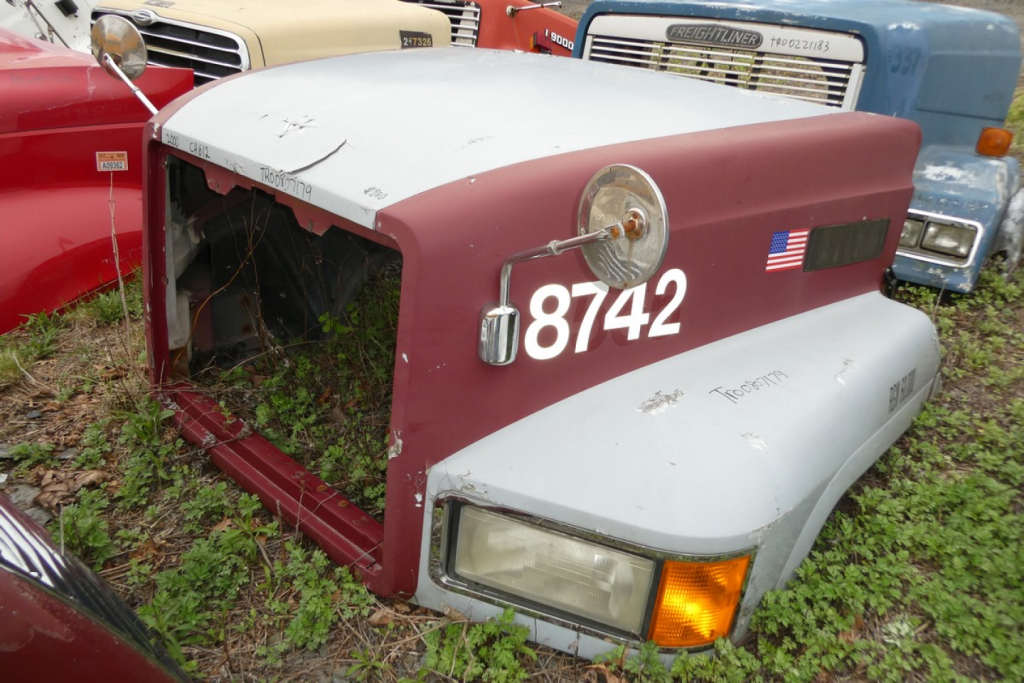 Mack CH612 hood assembly showing maroon and silver paint with number 8742 and a small American flag decal.
