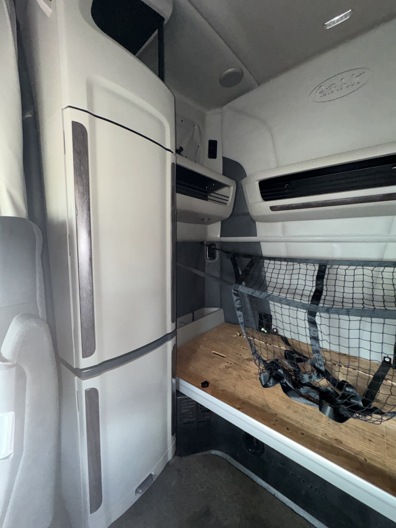 Peterbilt 579 interior sleeper cab cargo area with bunk and storage netting visible