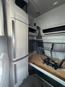 Peterbilt 579 interior sleeper cab cargo area with bunk and storage netting visible