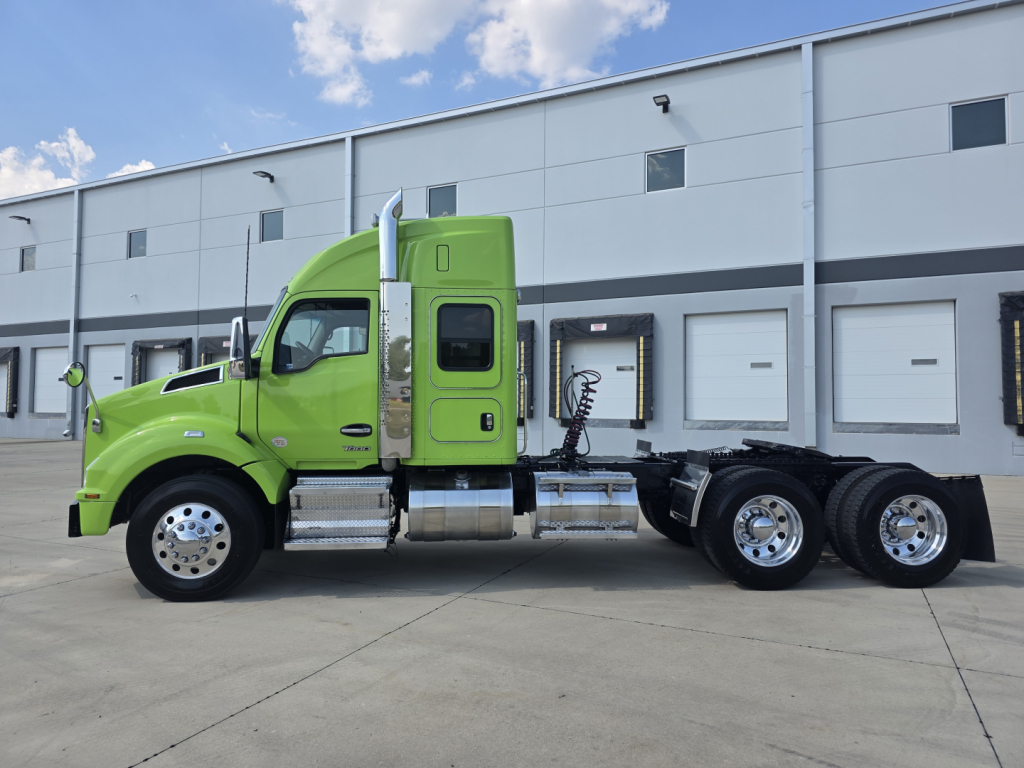 Kenworth T880 conventional sleeper truck side profile in lime green, with chassis and dual rear axles visible.