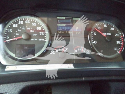 Hino 268A dashboard showing speedometer, tachometer, and digital display with various readouts in instrument cluster.