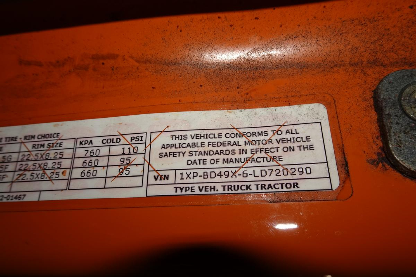 VIN/Compliance plate on Peterbilt truck showing weight and tire data: VIN 1XPBD49X6LD720290 and text about federal motor vehicle safety standards; also includes ‘TYPE VEH. TRUCK TRACTOR’.