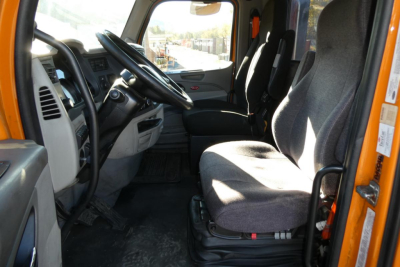 Peterbilt 579 truck interior view showing driver and passenger seats, steering wheel, and dashboard.