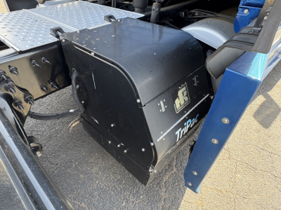 Truck accessory drawer/box mounted under cab with 'Trip Pro' logo and 'GS' emblem visible on black metal housing.