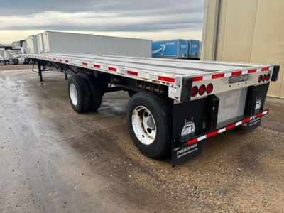 Trailers: 2020 Transcraft Combo Flatbed semi-trailer shown from rear-right side with dual rear axles and long aluminum deck.