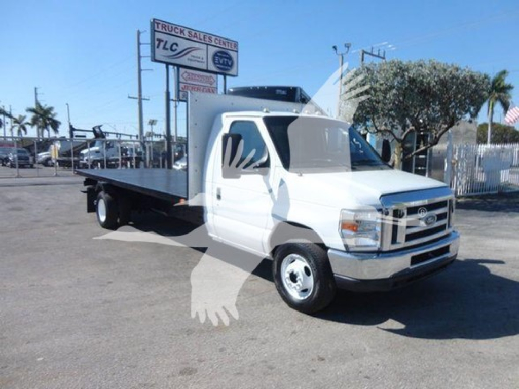 Ford E-Series cutaway truck with flatbed in front view showing VIN 1FDXE4FS3BDB20639 and TLC truck sales sign.