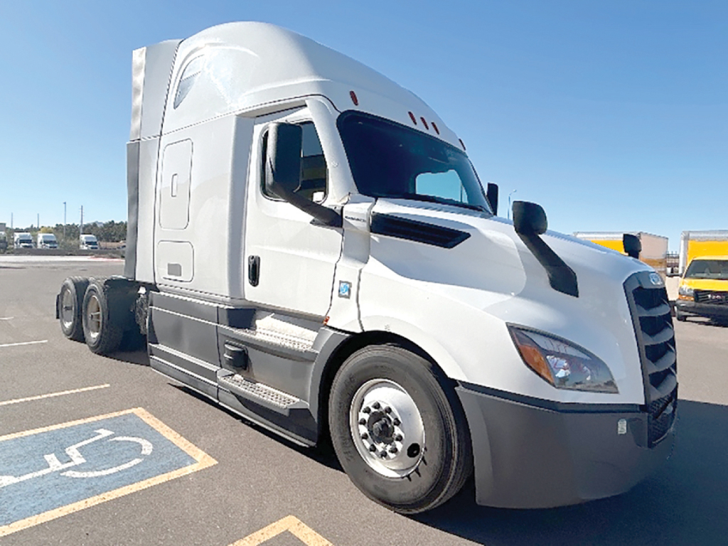 Truck cab in a parking lot with Freightliner Cascadia 126 sleeper model, front-right view, VIN tag not visible, stock number 549774.