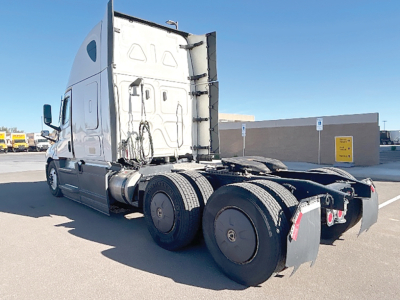 Freightliner Cascadia126 tractor rearview showing fifth wheel and dual rear axles with tandem setup.