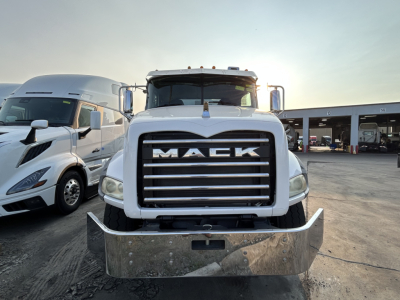 Front view of a white 2020 Mack GR64B mixer truck with large chrome grille, bumper guard, and dual side mirrors.