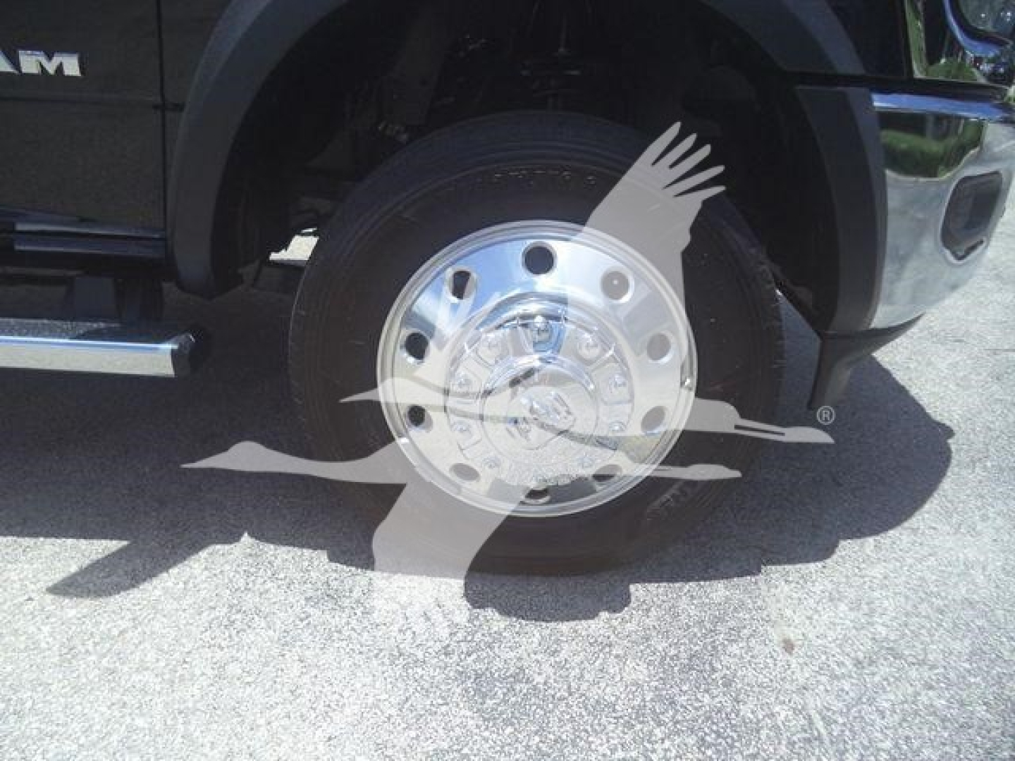 Ram 5500 wheel and chrome hub showing wheel and tire with overlay watermark.
