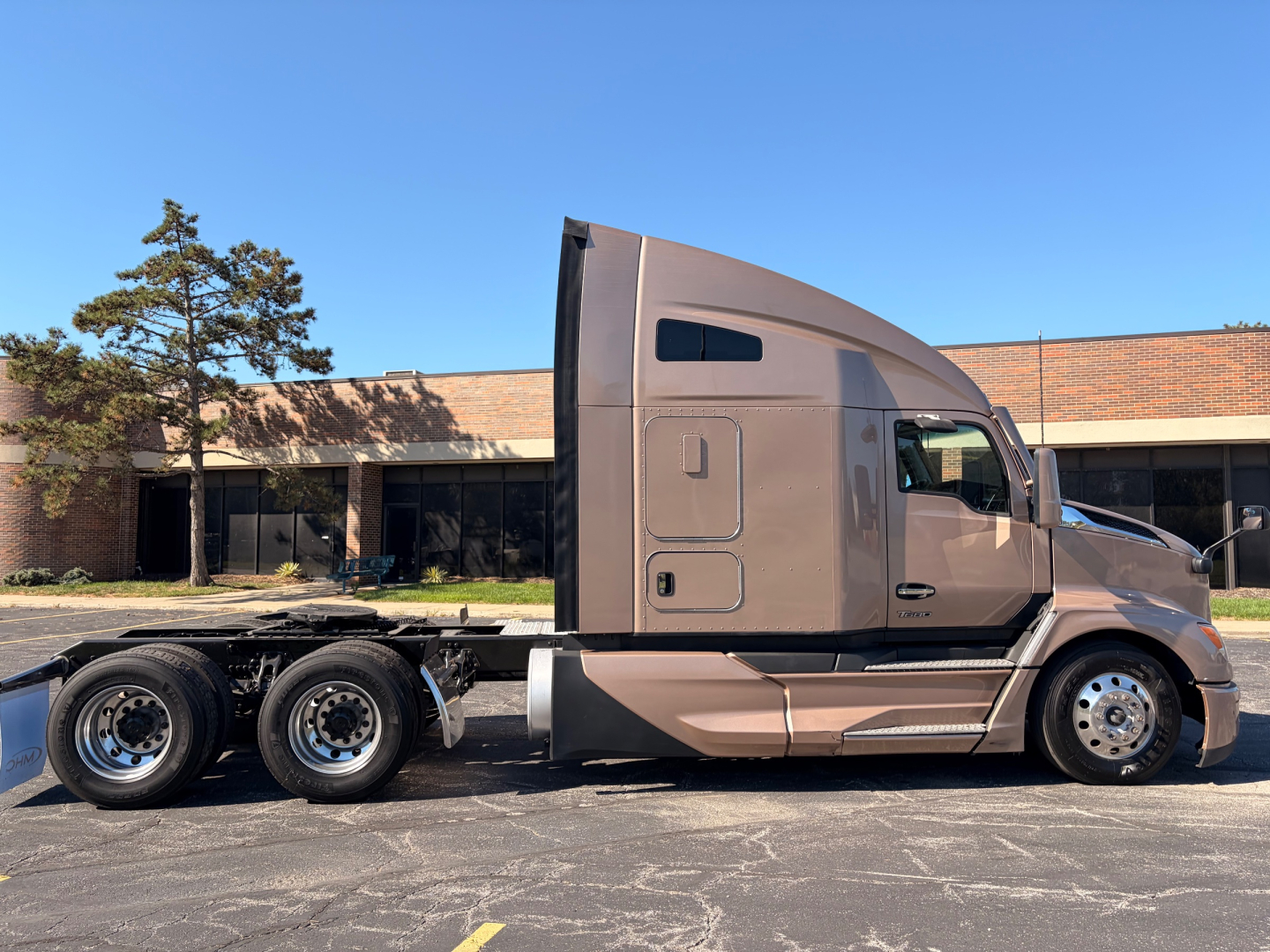 Kenworth T680 truck side view showing sleeper cab and 6x4 tractor configuration with dual rear axles.