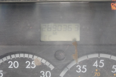Dashboard odometer display showing 289,036 miles with surrounding gauge numbers 20-70 and partial warning indicator.